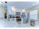 Updated kitchen featuring granite countertops, stainless steel appliances, and modern lighting at 13870 Oakwood Ln # 13870, Seminole, FL 33776