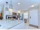 Updated kitchen featuring granite countertops, stainless steel appliances, and modern lighting at 13870 Oakwood Ln # 13870, Seminole, FL 33776