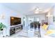 Cozy living room with modern furnishings and a sliding door leading to the outside patio at 13870 Oakwood Ln # 13870, Seminole, FL 33776