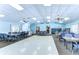 Spacious meeting room with neutral paint, lots of tables, and plenty of natural lighting at 13870 Oakwood Ln # 13870, Seminole, FL 33776