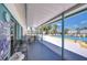 Relaxing pool area with covered seating, views of the pool, and lush landscaping at 13870 Oakwood Ln # 13870, Seminole, FL 33776