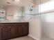 Bathroom featuring a double sink vanity and a glass walk-in shower at 1430 Blue Horizon Cir, Bradenton, FL 34208