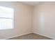 Bedroom with carpet, neutral walls, and a window at 1430 Blue Horizon Cir, Bradenton, FL 34208