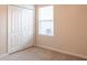 Bedroom with carpeting and a large window with blinds at 1430 Blue Horizon Cir, Bradenton, FL 34208