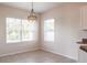 Bright dining area with large windows and modern light fixture at 1430 Blue Horizon Cir, Bradenton, FL 34208