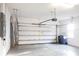 Spacious two-car garage with epoxy flooring and ample storage space at 1430 Blue Horizon Cir, Bradenton, FL 34208