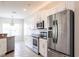 Modern kitchen design with stainless steel refrigerator and white cabinetry at 1430 Blue Horizon Cir, Bradenton, FL 34208