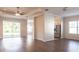 Bright and spacious living room with modern wood-look floors and a ceiling fan at 1430 Blue Horizon Cir, Bradenton, FL 34208