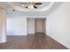 Large living room featuring modern wood-look floors, ample natural light, and an open floor plan at 1430 Blue Horizon Cir, Bradenton, FL 34208