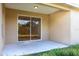 Covered patio area with sliding glass doors leading to the backyard and outdoor space at 1430 Blue Horizon Cir, Bradenton, FL 34208