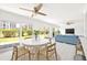 Beautiful living room with floor to ceiling windows and views of the backyard and neighborhood at 1451 Gulf Blvd # 117, Clearwater Beach, FL 33767