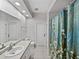 Bathroom features a patterned shower curtain and tile flooring at 14721 Scharber Rd, Dade City, FL 33525