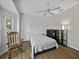Bright bedroom with a bay window, ceiling fan, and wood-look flooring at 14721 Scharber Rd, Dade City, FL 33525
