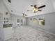 Spacious bonus room features a wet bar and multiple windows for natural light at 14721 Scharber Rd, Dade City, FL 33525