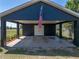 Covered carport featuring the American flag at 14721 Scharber Rd, Dade City, FL 33525