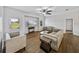Inviting living room featuring wood-look flooring, neutral decor, and bright natural light at 14721 Scharber Rd, Dade City, FL 33525