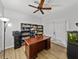 Office space with desk, bookshelf, ceiling fan and french doors at 14721 Scharber Rd, Dade City, FL 33525