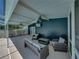 Covered patio with comfortable seating and ceiling fans, perfect for relaxation at 14721 Scharber Rd, Dade City, FL 33525