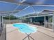Screened-in pool with patio furniture provides a comfortable outdoor space for entertainment and leisure at 14721 Scharber Rd, Dade City, FL 33525