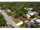 Charming single-story home with a well-maintained lawn, mature trees, and a long driveway leading to the house at 1644 Scott St, Clearwater, FL 33755