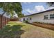 Private fenced backyard with lush lawn and potential for outdoor enjoyment at 1644 Scott St, Clearwater, FL 33755