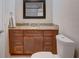 Bathroom featuring a vanity with granite countertop and modern fixtures at 1644 Scott St, Clearwater, FL 33755