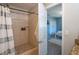 Bathroom featuring tiled shower, modern fixtures, and easy access to the bedroom at 1644 Scott St, Clearwater, FL 33755