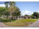Spacious single-story home featuring a well-maintained lawn and mature trees at 1644 Scott St, Clearwater, FL 33755