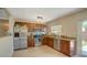 Well-lit kitchen featuring stainless steel appliances and granite countertops at 1644 Scott St, Clearwater, FL 33755