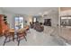 Open concept area offering dining and living room combination, connected to the kitchen at 16665 Delia St, Wimauma, FL 33598