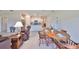 Open-concept design with living room connected to the dining and kitchen area with tile flooring at 16665 Delia St, Wimauma, FL 33598