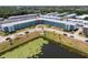 Aerial view of a well-maintained condo complex and lush landscaping at 1950 59Th N Ave # 208, St Petersburg, FL 33714