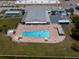 Aerial view of a community pool featuring lounge chairs at 1950 59Th N Ave # 208, St Petersburg, FL 33714