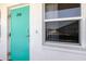 Condo unit exterior door and window with a peek at the neighboring building at 1950 59Th N Ave # 208, St Petersburg, FL 33714