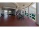 View of the common area with tables and chairs and an elevator at 1950 59Th N Ave # 208, St Petersburg, FL 33714