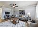 Comfortable living room featuring a ceiling fan, modern furnishings, and a stylish accent rug at 1950 59Th N Ave # 208, St Petersburg, FL 33714