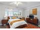 Bright primary bedroom offering a modern design, a window view, and dark wood floors at 1950 59Th N Ave # 208, St Petersburg, FL 33714