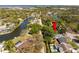 Scenic aerial view of waterfront property surrounded by lush trees and tranquil canals at 2382 Pembrook Dr, Clearwater, FL 33764