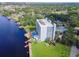 Scenic aerial view of condo with a pool and dock, nestled along the tranquil waterfront at 2780 N Riverside Dr # 802, Tampa, FL 33602