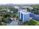 Waterfront apartment complex featuring a tennis court and lush landscaping with river views at 2780 N Riverside Dr # 802, Tampa, FL 33602