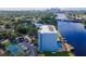 Aerial view of a waterfront apartment complex featuring a swimming pool and tennis court at 2780 N Riverside Dr # 802, Tampa, FL 33602