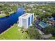 Aerial view of condo featuring a pool and tennis court and convenient parking at 2780 N Riverside Dr # 802, Tampa, FL 33602