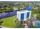 Aerial view of condo with tennis court, parking, and landscaping at 2780 N Riverside Dr # 802, Tampa, FL 33602