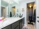 Stylish bathroom with black fixtures, unique chandelier, and modern design at 2780 N Riverside Dr # 802, Tampa, FL 33602