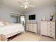 Cozy bedroom with white furniture, a ceiling fan, and natural light at 2780 N Riverside Dr # 802, Tampa, FL 33602