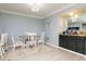 Charming dining area featuring a stylish bar area with granite counter and light wood plank floors at 2780 N Riverside Dr # 802, Tampa, FL 33602