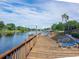 Enjoy water views and relax on the wooden deck with lounge chairs at 2780 N Riverside Dr # 802, Tampa, FL 33602
