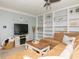 Spacious living room with custom built-in shelving and a comfortable sectional sofa, perfect for relaxing at 2780 N Riverside Dr # 802, Tampa, FL 33602