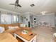 Open-concept living room with sectional sofa, a dining area, and access to a balcony at 2780 N Riverside Dr # 802, Tampa, FL 33602