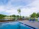 Beautiful pool area with lake views, palm tree, and lounge chairs at 2780 N Riverside Dr # 802, Tampa, FL 33602